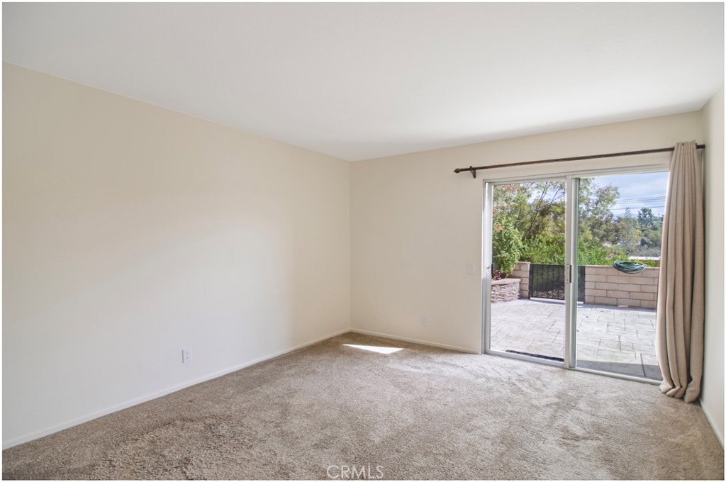 24802 Leto Circle Mission Viejo, CA 92691 - Photo 15 of 27 an empty room with glass door