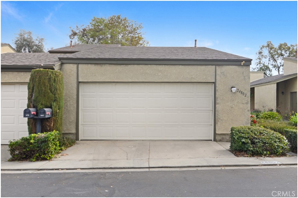 24802 Leto Circle Mission Viejo, CA 92691 - Photo 2 of 27 a front view of a house with a garage
