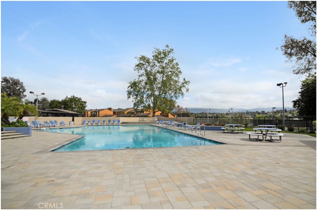 24802 Leto Circle Mission Viejo, CA 92691 - Photo 23 of 27 a view of a swimming pool with lounge chair