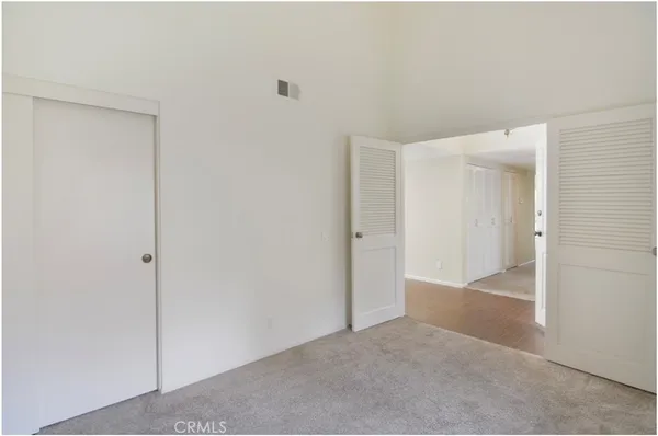 a view of hallway with closet