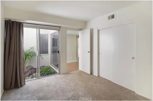 a view of a room with a large window