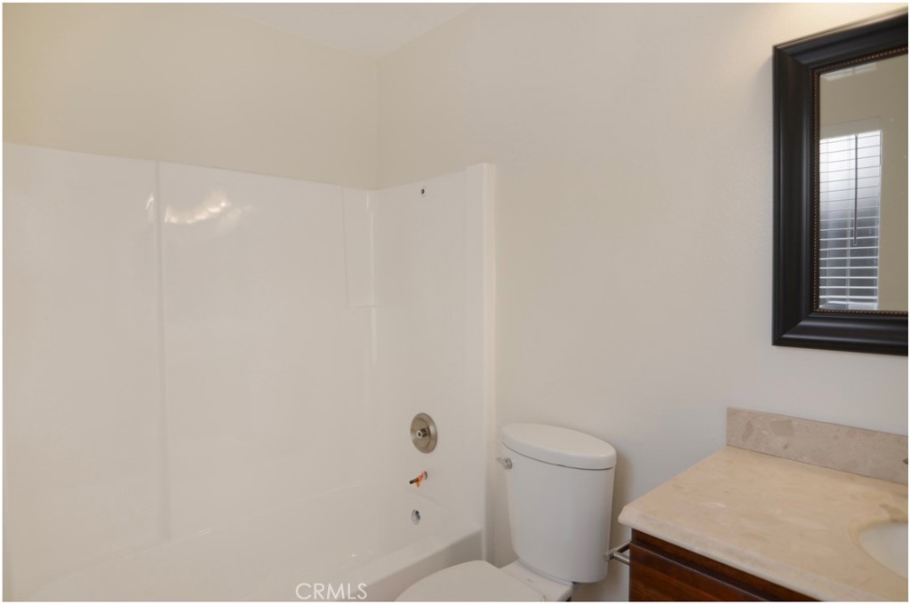 24802 Leto Circle Mission Viejo, CA 92691 - Photo 7 of 27 a bathroom with a toilet and a sink