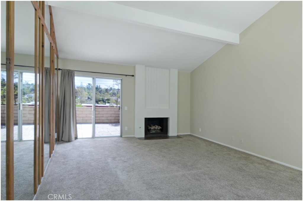 24802 Leto Circle Mission Viejo, CA 92691 - Photo 9 of 27 a view of an empty room with a fireplace