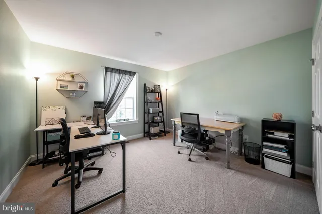 a view of a workspace with furniture