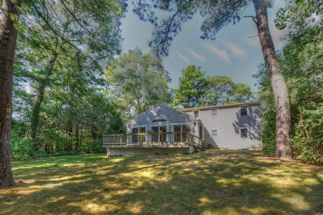 436 Skunknet Road Centerville, MA 02632 - Photo 3 of 15 a front view of a house with a yard