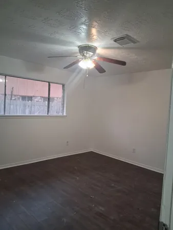 a view of a room that has a window in it