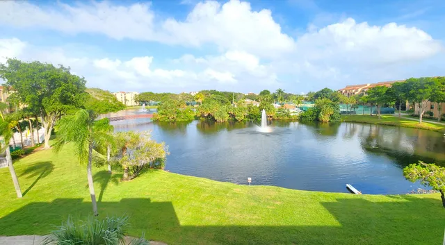 a view of a lake with houses in the back