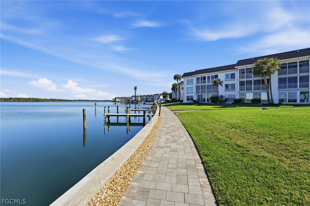 4440 Exeter Drive Longboat Key, FL 34228 - Photo 19 of 24 a view of a house with a yard