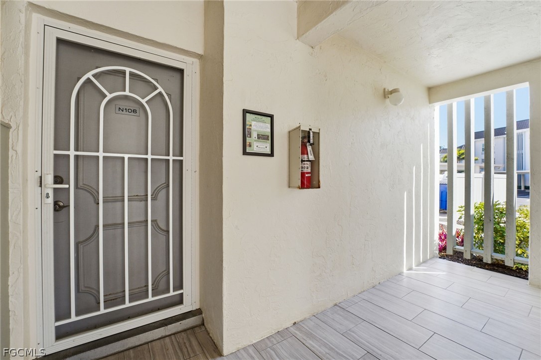 4440 Exeter Drive Longboat Key, FL 34228 - Photo 2 of 24 a view of a entryway door with wooden floor
