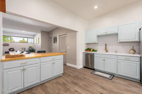 a kitchen with stainless steel appliances a stove microwave and refrigerator