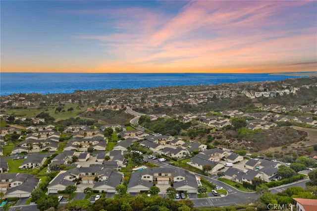 an aerial view of city and lake