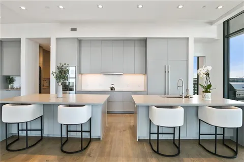 a kitchen with stainless steel appliances granite countertop a sink and cabinets