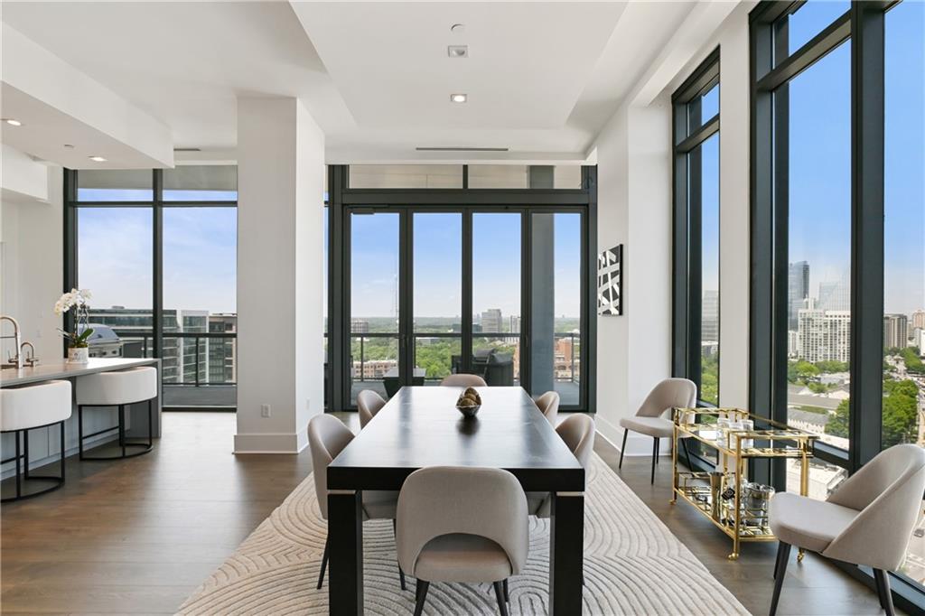 3107 Peachtree Road Northeast, Unit 2003 Atlanta, GA 30305 - Photo 17 of 114 a view of a dining room with furniture window and wooden floor