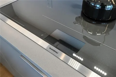 a living room with furniture a refrigerator and a table