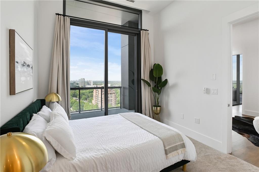 3107 Peachtree Road Northeast, Unit 2003 Atlanta, GA 30305 - Photo 41 of 114 a bedroom with a bed and a large window