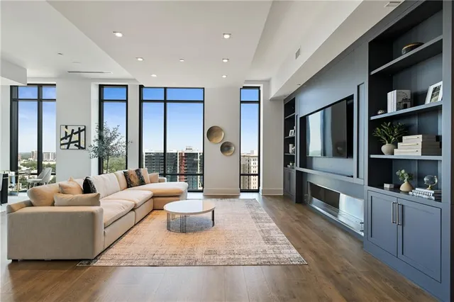 a large white kitchen with a large window