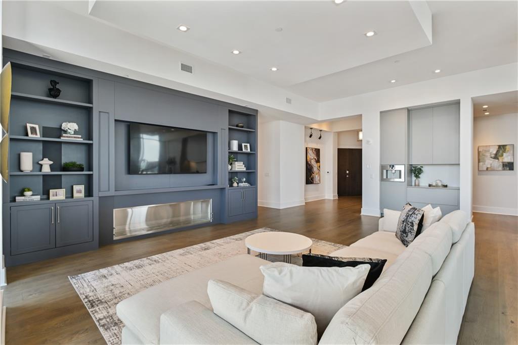 3107 Peachtree Road Northeast, Unit 2003 Atlanta, GA 30305 - Photo 8 of 114 a living room with furniture and a flat screen tv