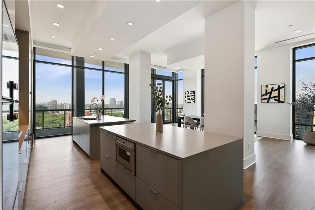 3107 Peachtree Road Northeast, Unit 2003 Atlanta, GA 30305 - Photo 10 of 114 a large white kitchen with a large window