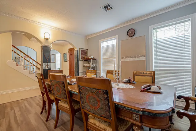a view of a dining room with furniture and window