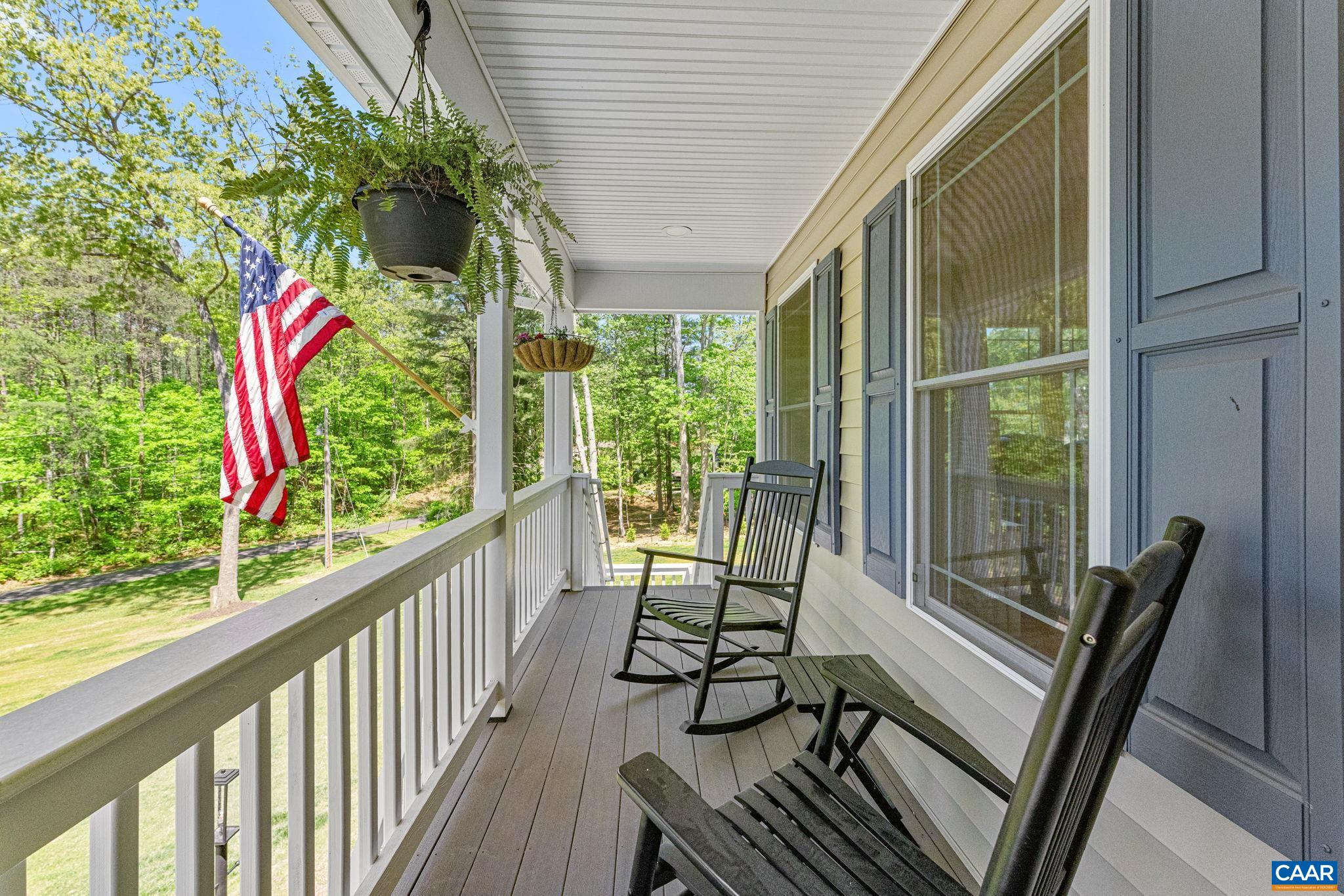 230 Fox Hollow Road Ruckersville, VA 22968 - Photo 4 of 42 a view of a balcony with chairs and wooden floor