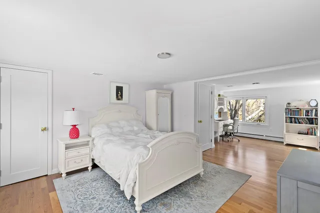 a living room with furniture and a book shelf