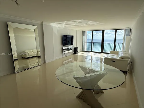 a view of a living room and dining room