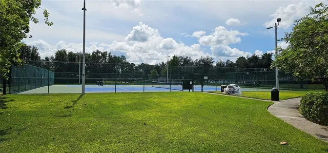 a view of a backyard with sitting area