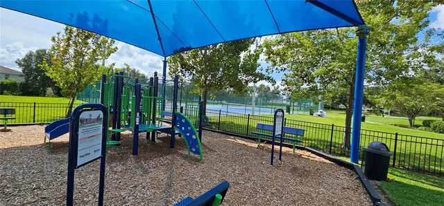 a view of a wrought iron fences in front of house