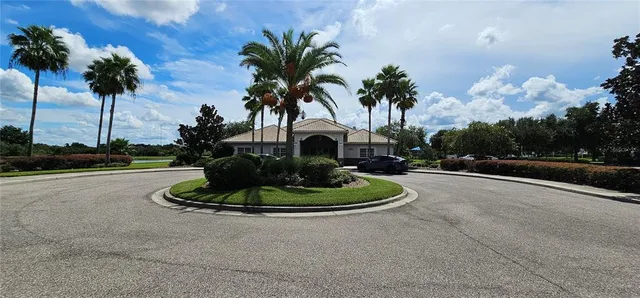 a view of a lake with houses in the background
