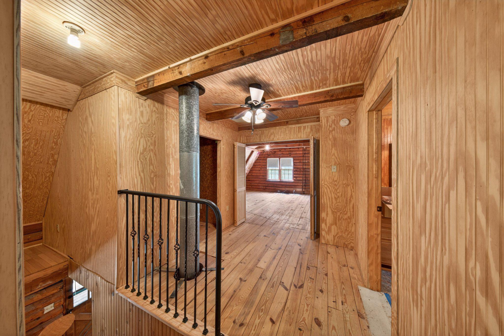 403 Union Church Road Townsend, DE 19734 - Photo 39 of 73 a view of a hallway with wooden floor and staircase