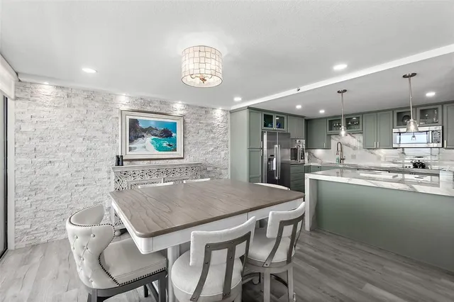 a kitchen with a table and chairs in it