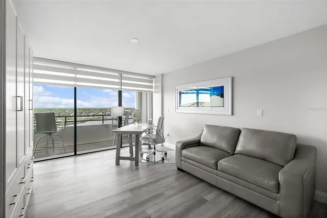 a view of a room with a table and chairs
