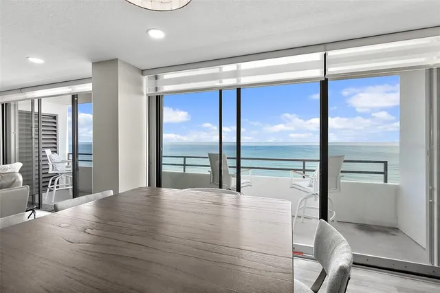 a room with wooden floor and windows
