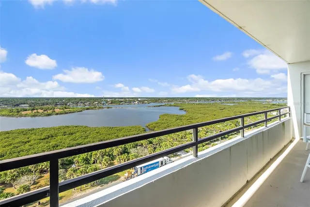 a view of swimming pool from a balcony