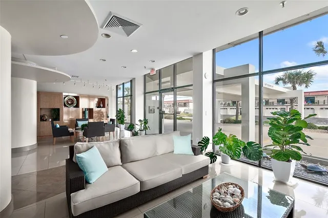 a view of a dining hall with furniture and a rug