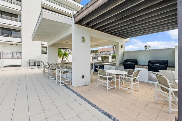a view of swimming pool with outdoor seating and yard in back