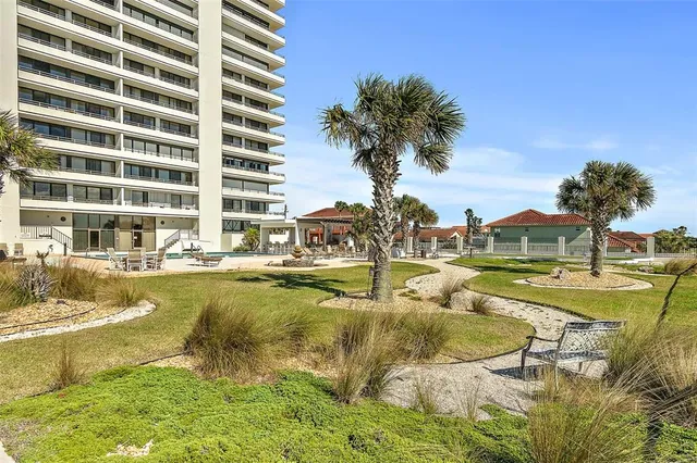 a view of building with yard