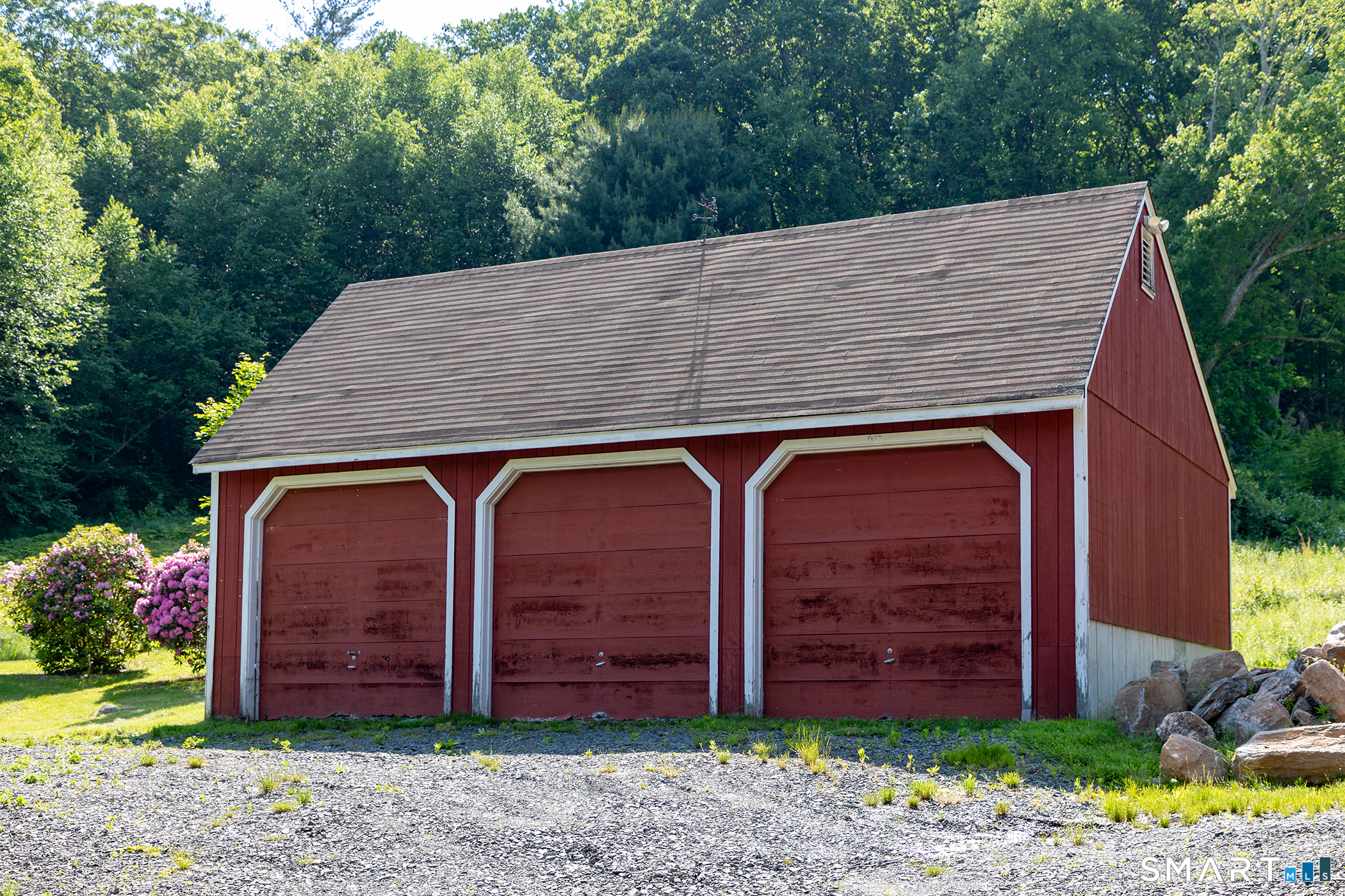 179 South Street Roxbury, CT 06783 - Photo 4 of 13 a view of a small house with wooden fence