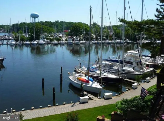 a view of swimming pool with outdoor seating yard and mountain view in back