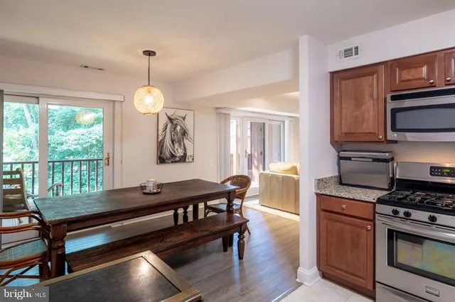 a view of a lake with boats and trees in the background