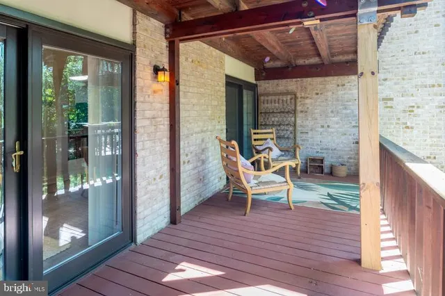 a kitchen with stainless steel appliances granite countertop a stove a sink dishwasher a dining table and chair with wooden floor