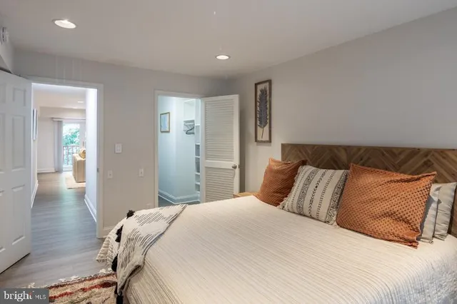 a bedroom with a bed and a lamp