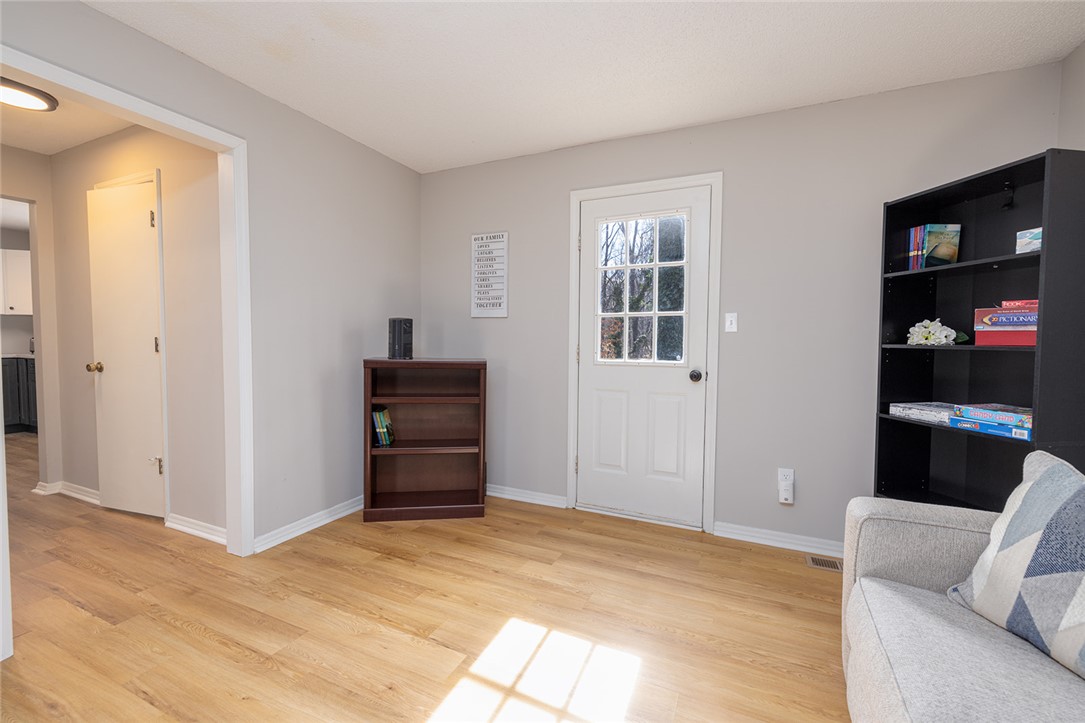 410 South Cove Road Seneca, SC 29672 - Photo 12 of 25 This bright living space features durable flooring and a clear-paned door, creating an inviting atmosphere.