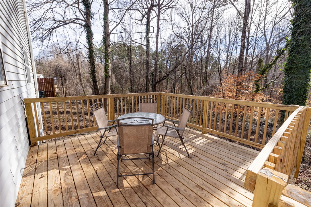 410 South Cove Road Seneca, SC 29672 - Photo 14 of 25 This spacious deck provides an idyllic setting for outdoor enjoyment and forest views.