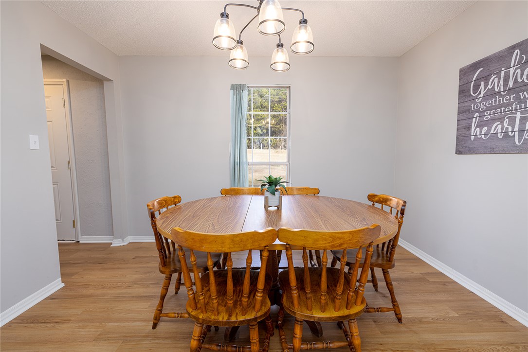 410 South Cove Road Seneca, SC 29672 - Photo 7 of 25 This dining area features durable flooring and a bright window, perfect for everyday meals and gatherings.