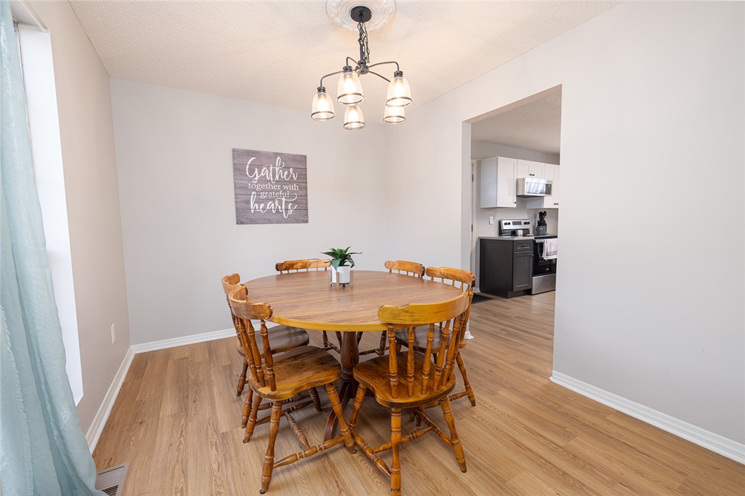 410 South Cove Road Seneca, SC 29672 - Photo 8 of 25 This inviting dining area features elegant wood flooring, creating a perfect space for meals and gatherings.