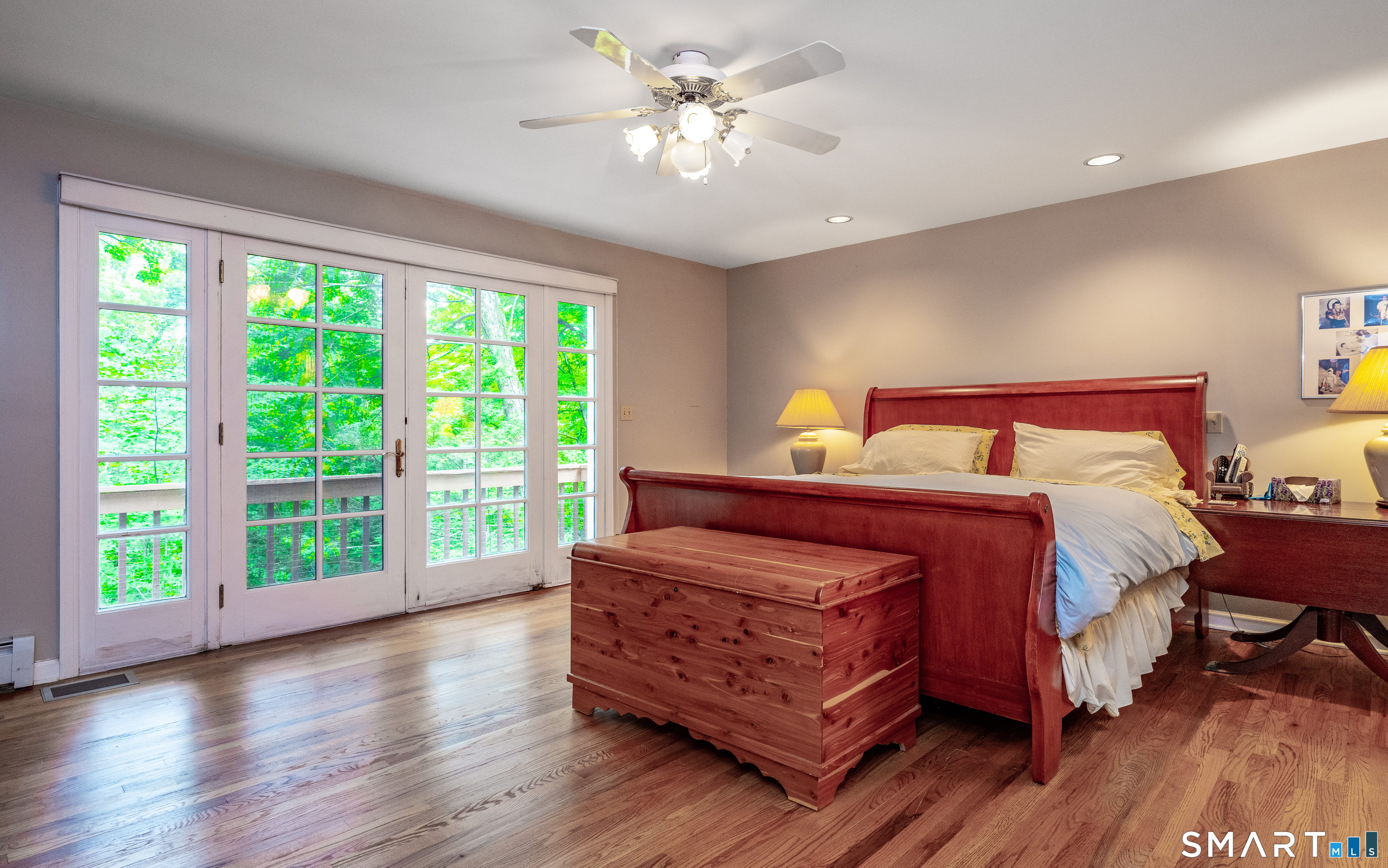 12 Woodin Road Kent, CT 06757 - Photo 22 of 31 Primary bedroom has french doors to a deck high in the trees