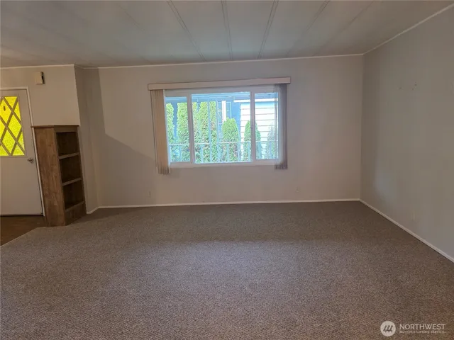 a view of an empty room and window