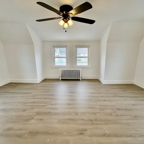 a view of livingroom with hardwood floor and ceiling fan