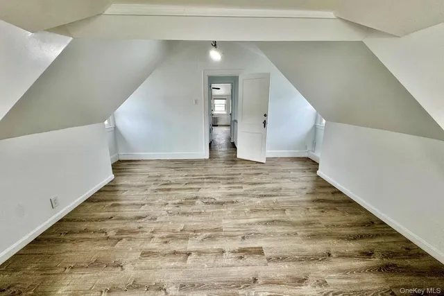 a view of an empty room and stairs